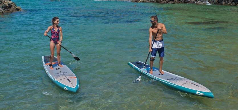 Paddlers On SIC Okeanos Touring Boards