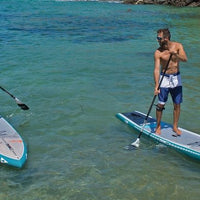 Paddlers On SIC Okeanos Touring Boards