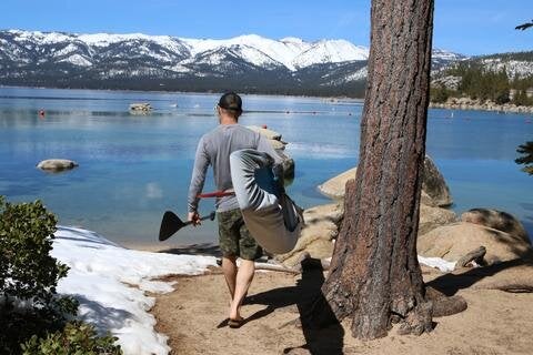 Paddler with vamo board cover on board